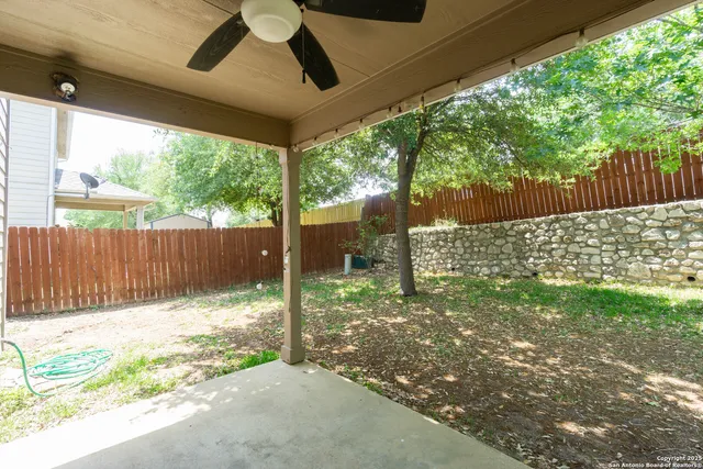 a backyard of a house with a garden and deck