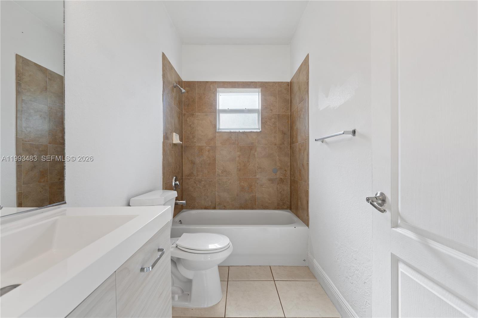 10357 Southwest 178th Street, Unit 10357 Miami, FL 33157 - Photo 18 of 25 a bathroom with a toilet a sink and shower