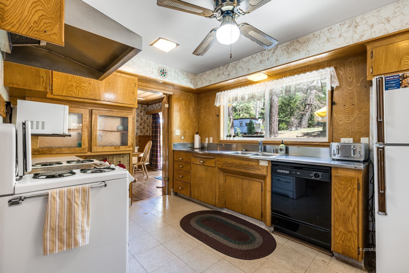 26770 Idyllwild Road Idyllwild, CA 92549 - Photo 13 of 56 a kitchen with stainless steel appliances granite countertop a stove a sink dishwasher and a microwave oven with cabinets
