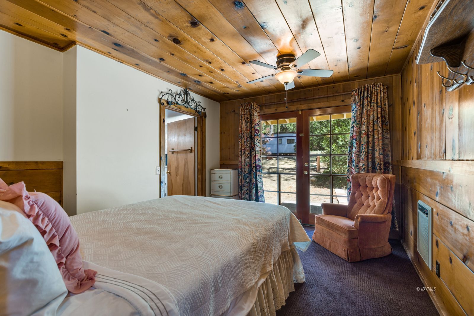 26770 Idyllwild Road Idyllwild, CA 92549 - Photo 16 of 56 a bedroom with a large bed and a large window