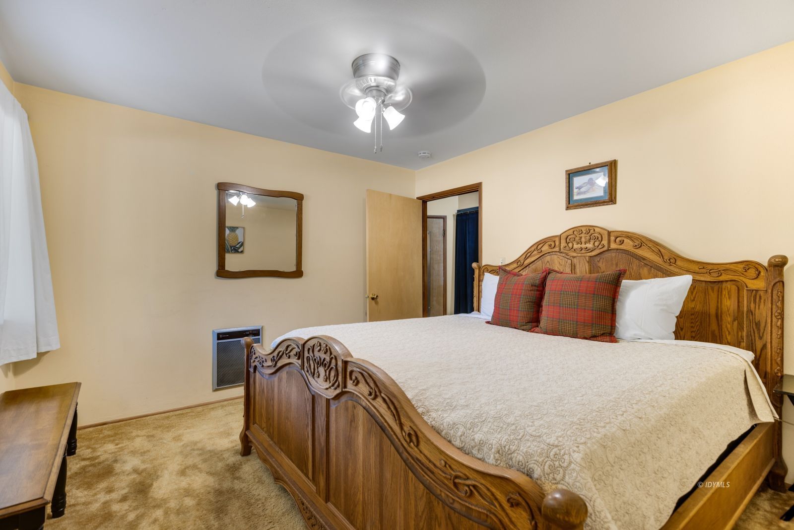 26770 Idyllwild Road Idyllwild, CA 92549 - Photo 22 of 56 a bedroom with a bed and a chandelier