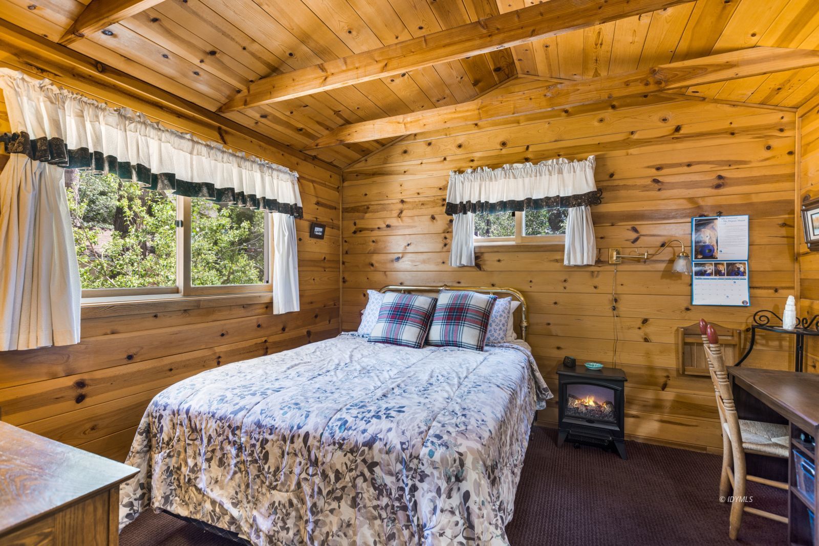 26770 Idyllwild Road Idyllwild, CA 92549 - Photo 31 of 56 a bedroom with a bed and wooden floor