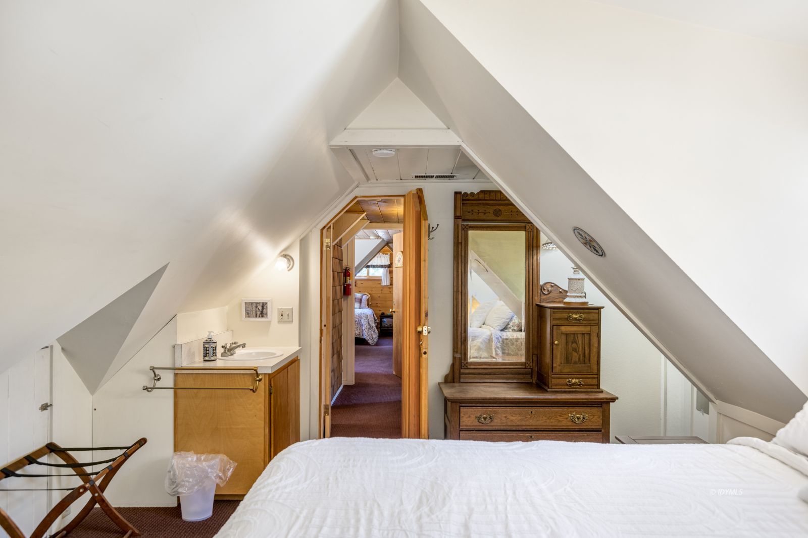 26770 Idyllwild Road Idyllwild, CA 92549 - Photo 37 of 56 a bedroom with a bed and wooden floor