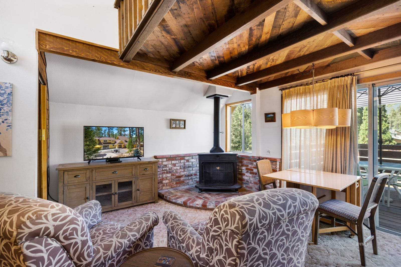 26770 Idyllwild Road Idyllwild, CA 92549 - Photo 38 of 56 a bedroom with furniture and a flat screen tv