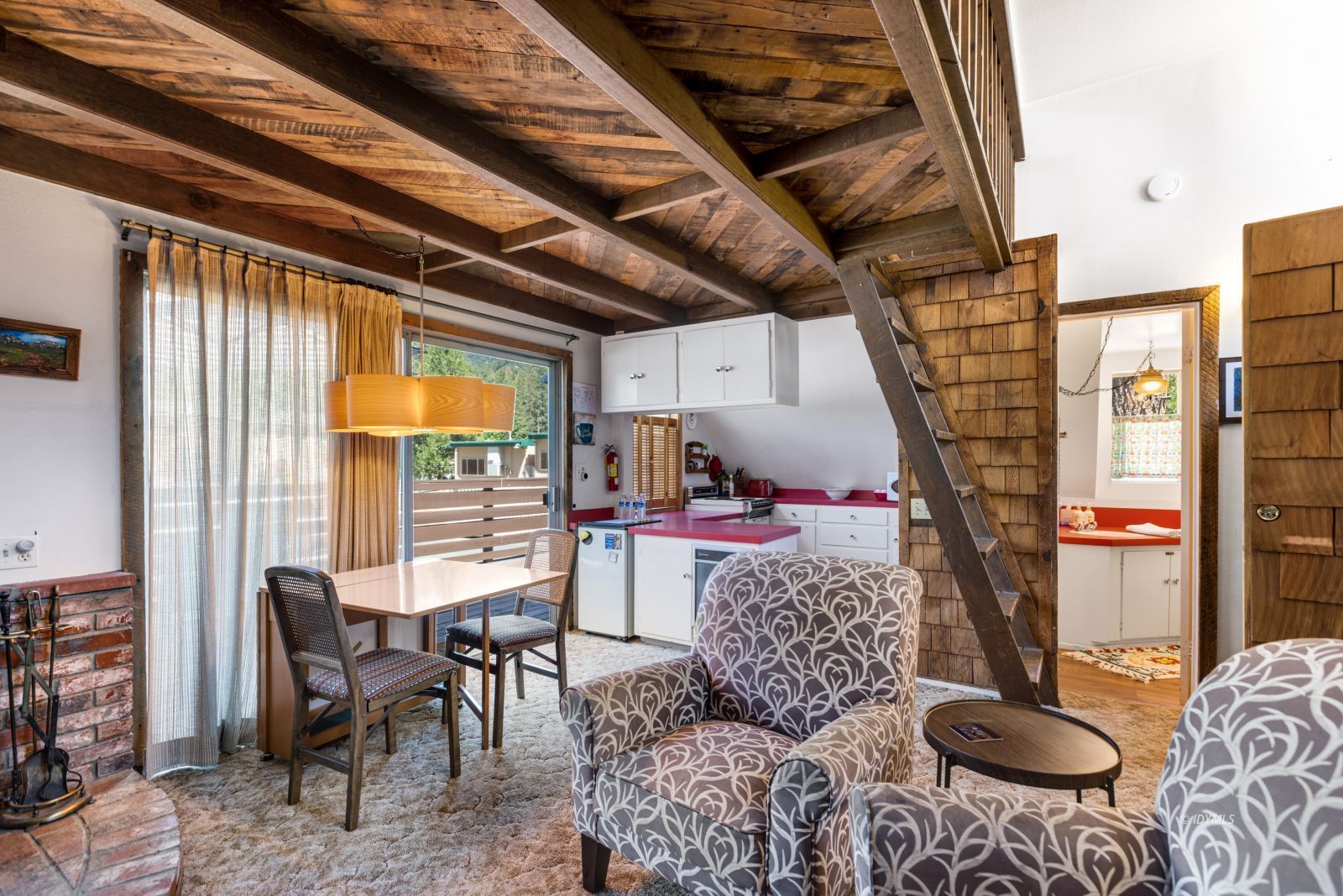 26770 Idyllwild Road Idyllwild, CA 92549 - Photo 40 of 56 a living room with furniture and a fireplace