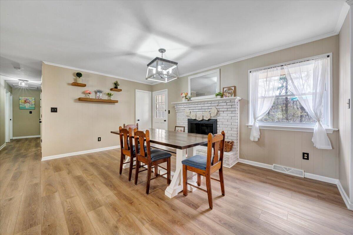 414 Pin Oak Drive Blue Ridge, VA 24064 - Photo 7 of 45 a view of a dining room with furniture window and wooden floor