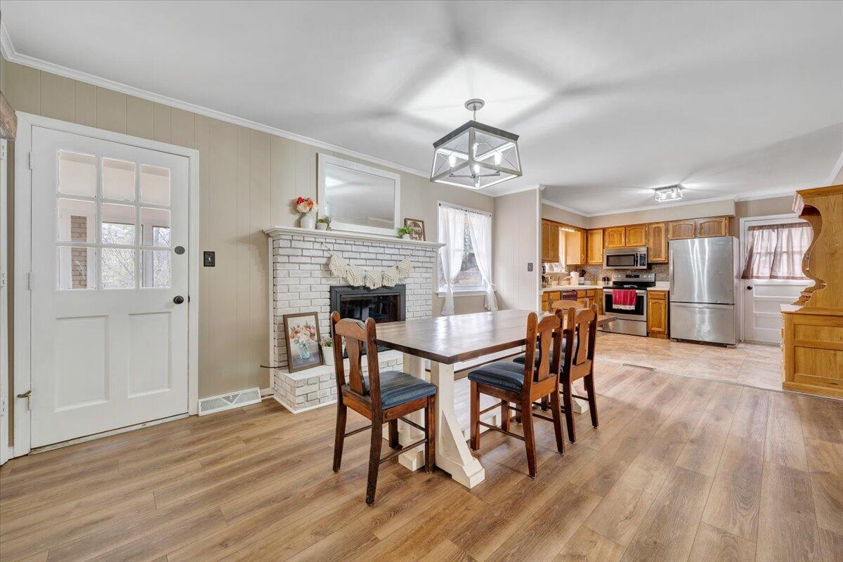 414 Pin Oak Drive Blue Ridge, VA 24064 - Photo 9 of 45 a view of a dining room with furniture window and wooden floor