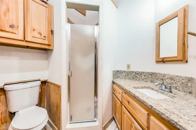 a bathroom with a granite countertop window and a sink