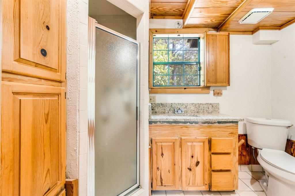 539 North Duncanville Road Cedar Hill, TX 75104 - Photo 26 of 36 a bathroom with a granite countertop window and a sink