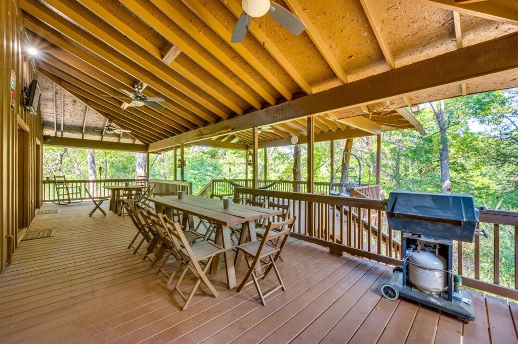 539 North Duncanville Road Cedar Hill, TX 75104 - Photo 32 of 36 a view of a patio with wooden floor table and chairs