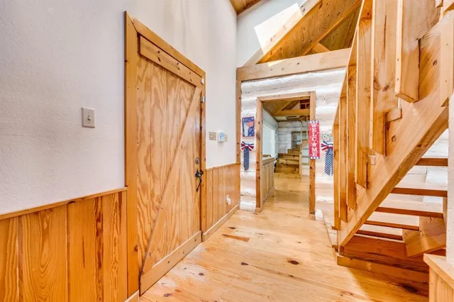 a view of an entryway with wooden floor