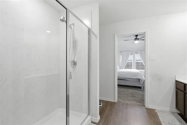 a en suite bathroom with a sink and a mirror