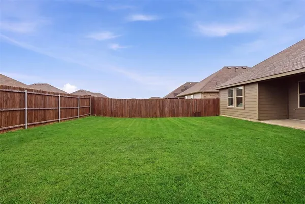 a view of a backyard with a garden