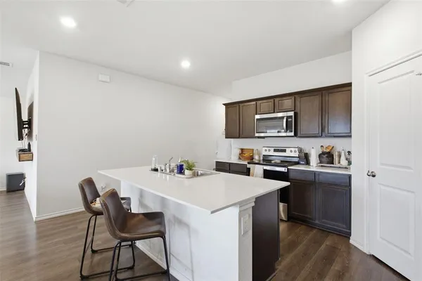 a view of kitchen with breakfast area