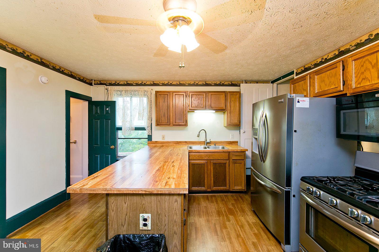 304 Cross Junction Road Cross Junction, VA 22625 - Photo 12 of 61 Big kitchen island & stainless steel appliances