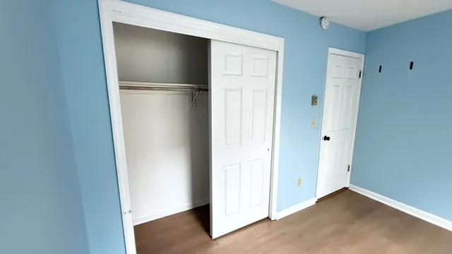 a view of empty room with closet