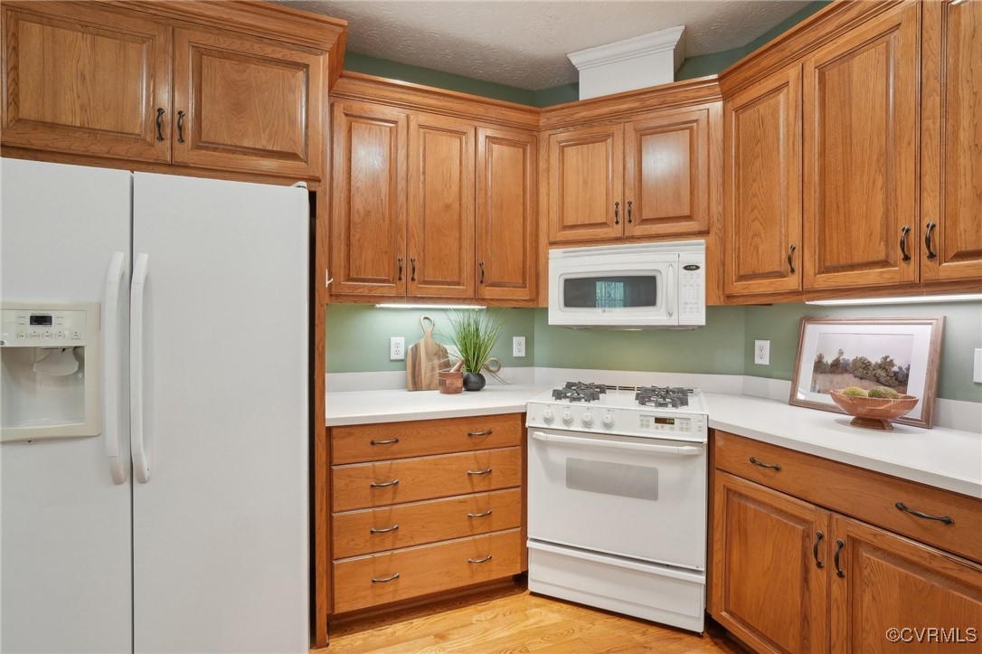 116 Moray Firth Williamsburg, VA 23188 - Photo 8 of 29 a kitchen with granite countertop cabinets and white appliances