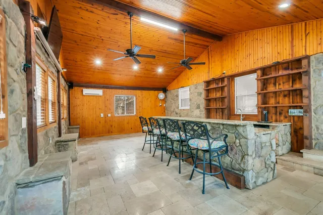 a view of a chairs and table in the patio