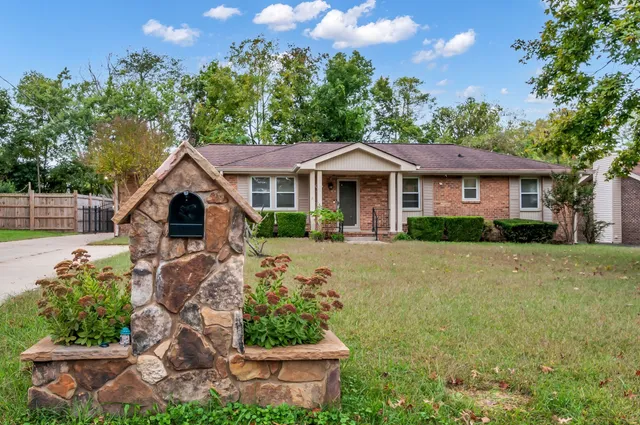 a front view of a house with garden