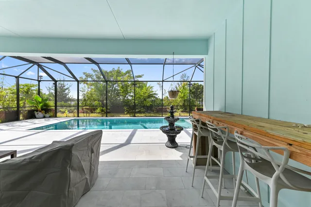 a bathroom with a toilet sink vanity and shower