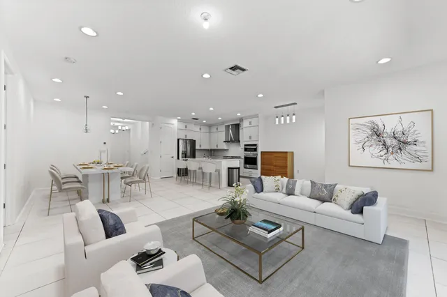 a kitchen with granite countertop a stove and a sink