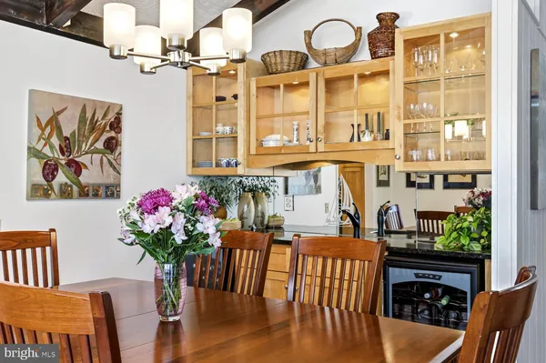 a kitchen with stainless steel appliances granite countertop a stove top oven a sink dishwasher a refrigerator and a microwave