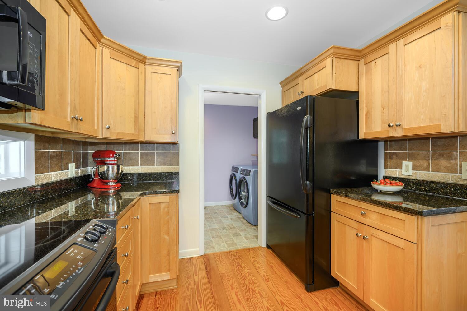 25711 Royal Road Royal Oak, MD 21662 - Photo 21 of 37 a kitchen with refrigerator and cabinets