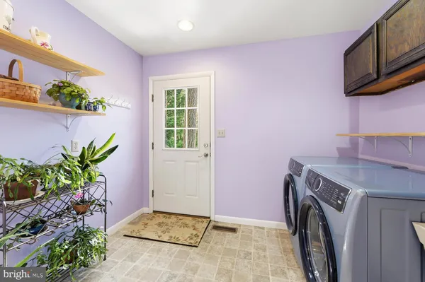 a view of storage and utility room with washer and dryer