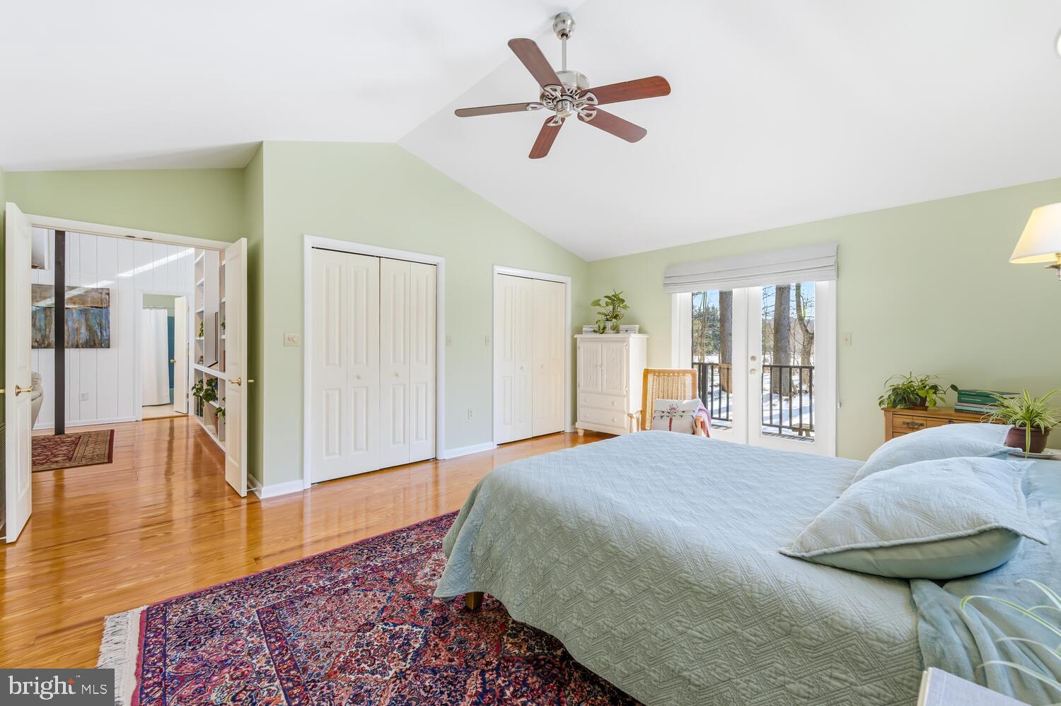 25711 Royal Road Royal Oak, MD 21662 - Photo 28 of 37 a bedroom with a bed and a chandelier