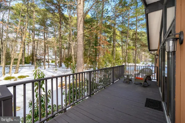a backyard of a house with outdoor seating