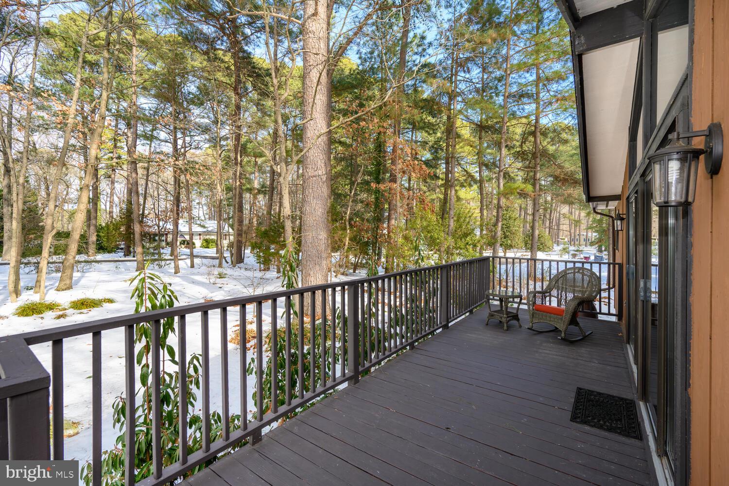 25711 Royal Road Royal Oak, MD 21662 - Photo 6 of 37 a view of a balcony with wooden floor and bench