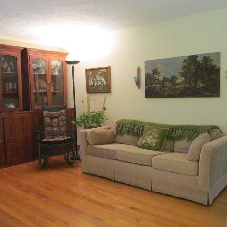 82 Little Turnpike Road Shirley, MA 01464 - Photo 13 of 27 a living room with furniture and a flat screen tv