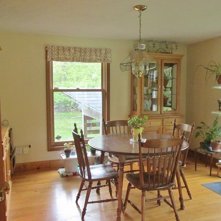 82 Little Turnpike Road Shirley, MA 01464 - Photo 17 of 27 a dining room with furniture window and wooden floor