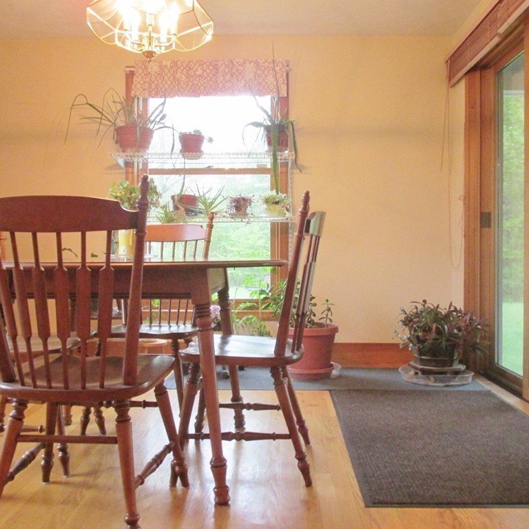 82 Little Turnpike Road Shirley, MA 01464 - Photo 18 of 27 a view of a dining room with furniture window and wooden floor