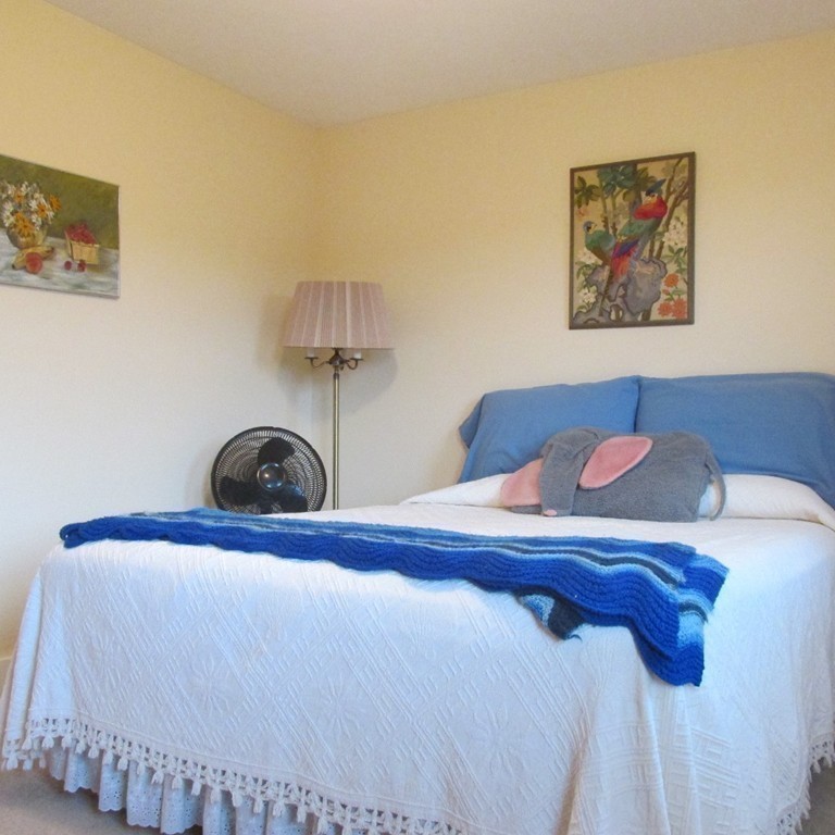 82 Little Turnpike Road Shirley, MA 01464 - Photo 22 of 27 a bedroom with a bed and a couch