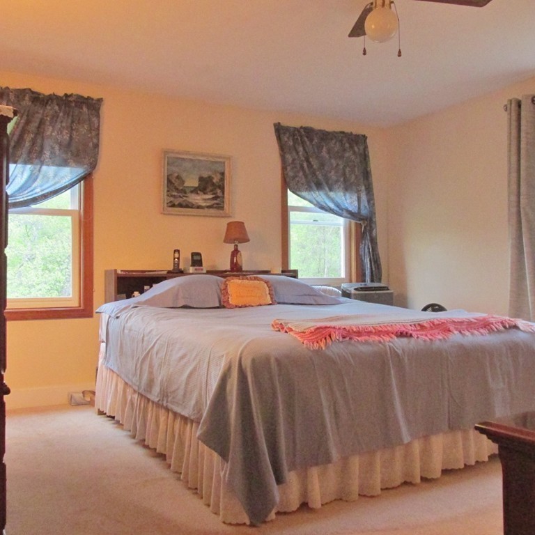82 Little Turnpike Road Shirley, MA 01464 - Photo 24 of 27 a bedroom with a bed and window