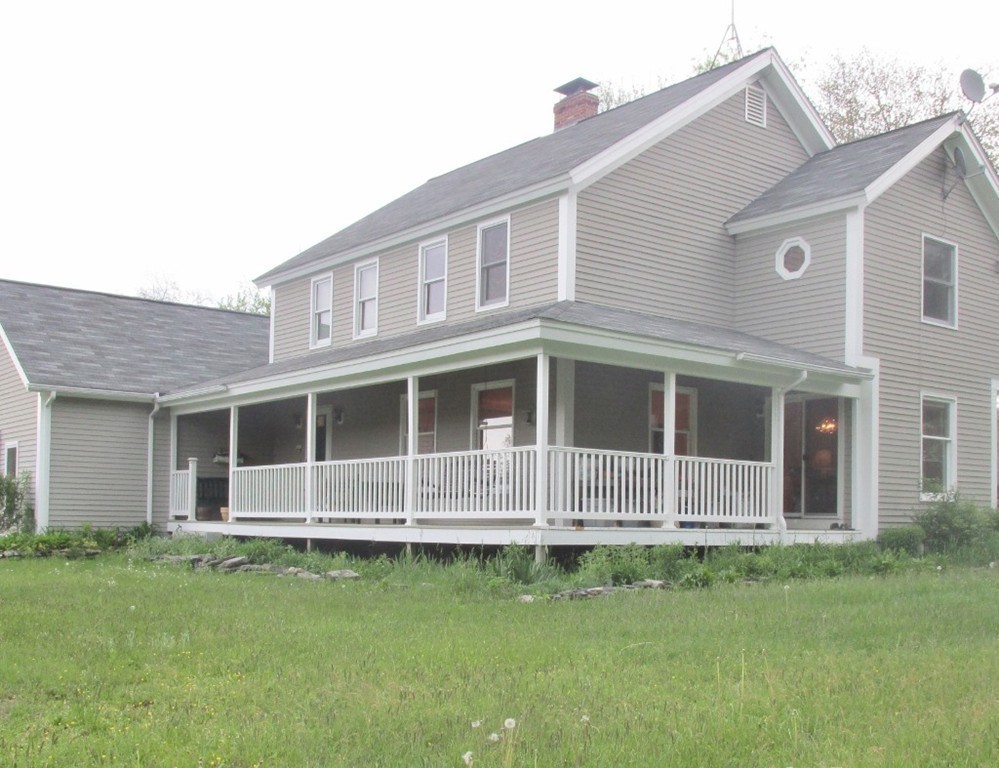 82 Little Turnpike Road Shirley, MA 01464 - Photo 8 of 27 a front view of a house with a garden