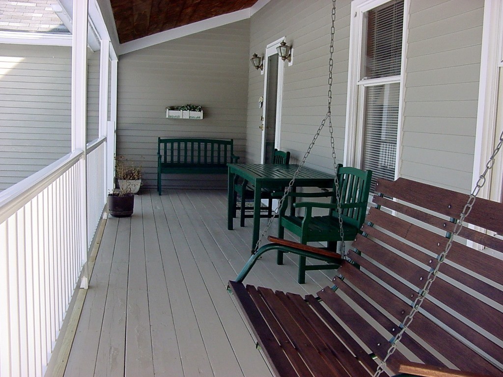 82 Little Turnpike Road Shirley, MA 01464 - Photo 9 of 27 a view of balcony with wooden floor outdoor seating and stairs