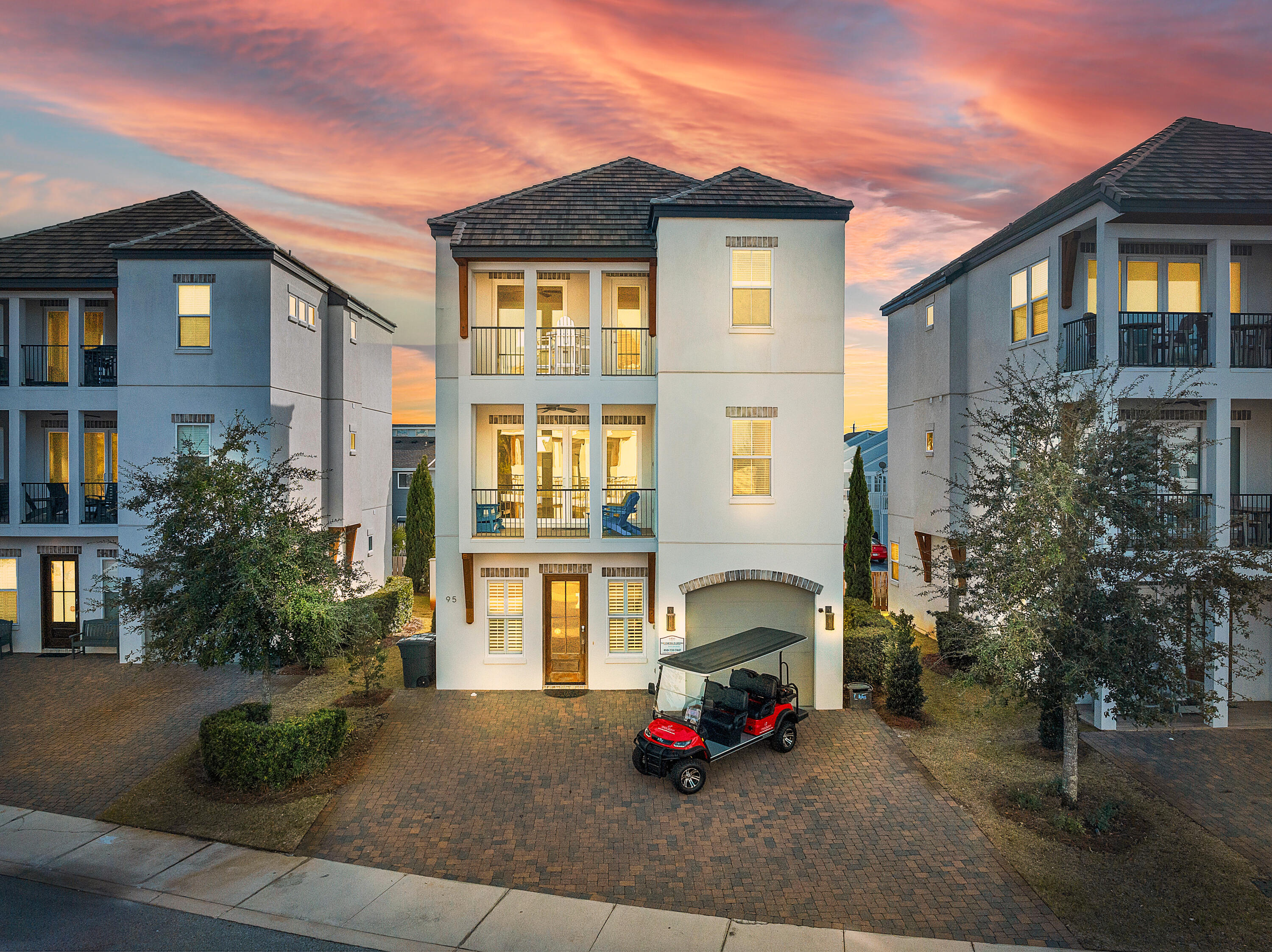 a car parked in front of a white house