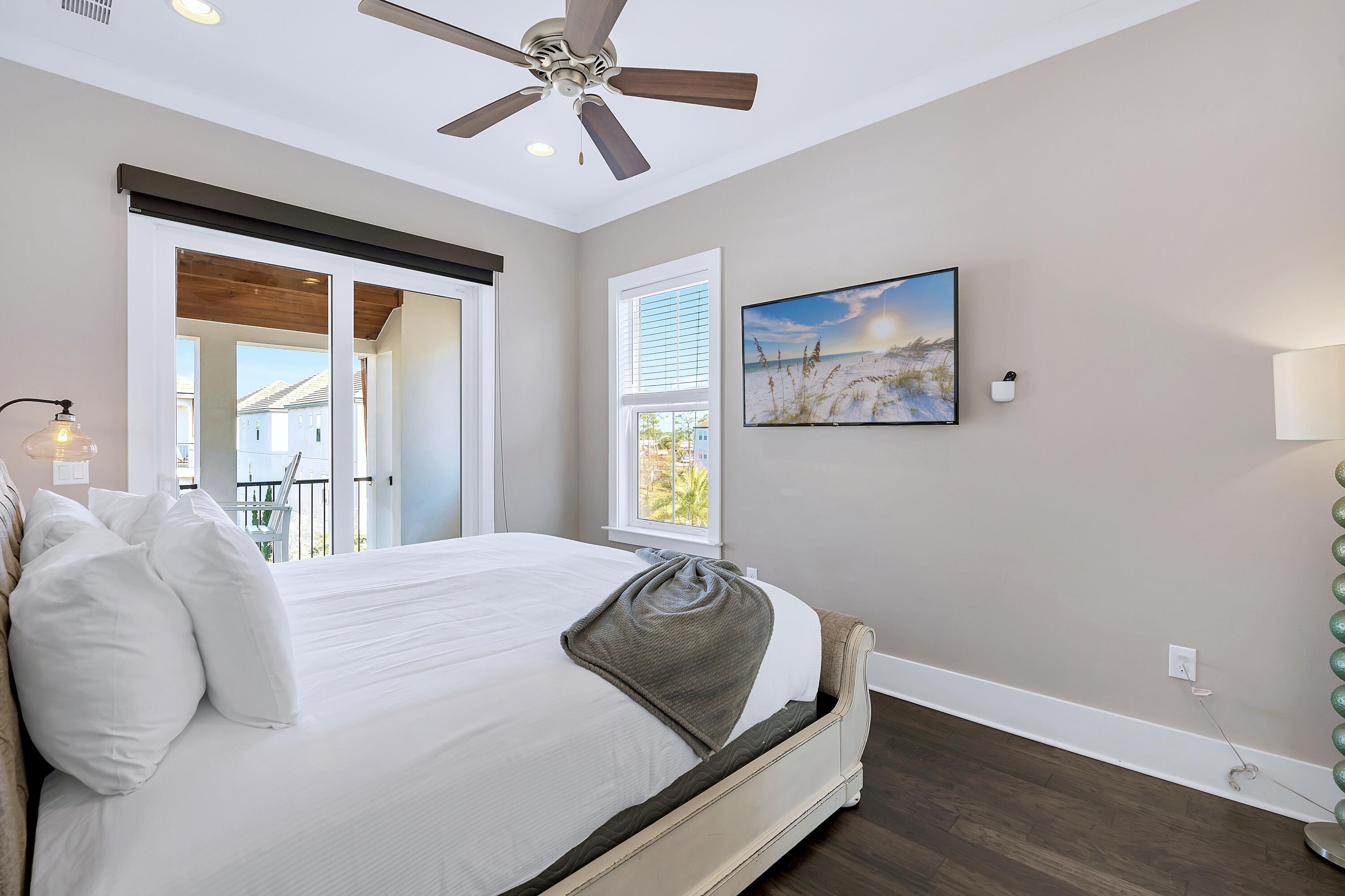 95 Wadleigh Way Miramar Beach, FL 32550 - Photo 33 of 53 a bedroom with a bed and wooden floor