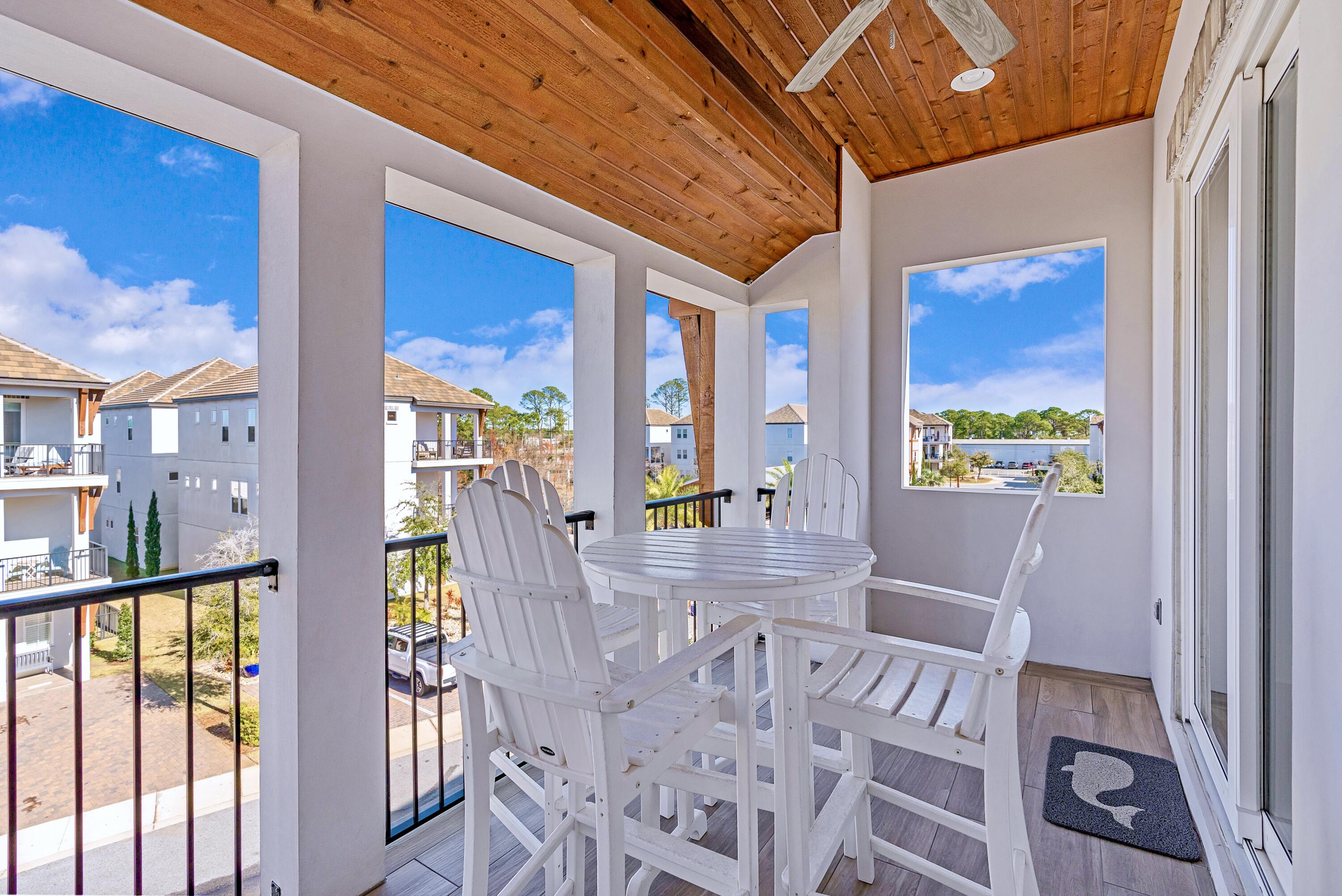 95 Wadleigh Way Miramar Beach, FL 32550 - Photo 36 of 53 a view of a dining room with furniture a chandelier and wooden floor
