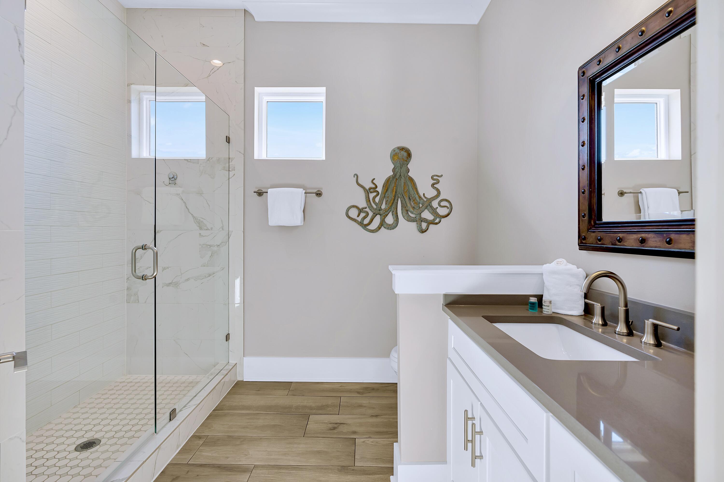 95 Wadleigh Way Miramar Beach, FL 32550 - Photo 39 of 53 a bathroom with a sink a mirror and a shower