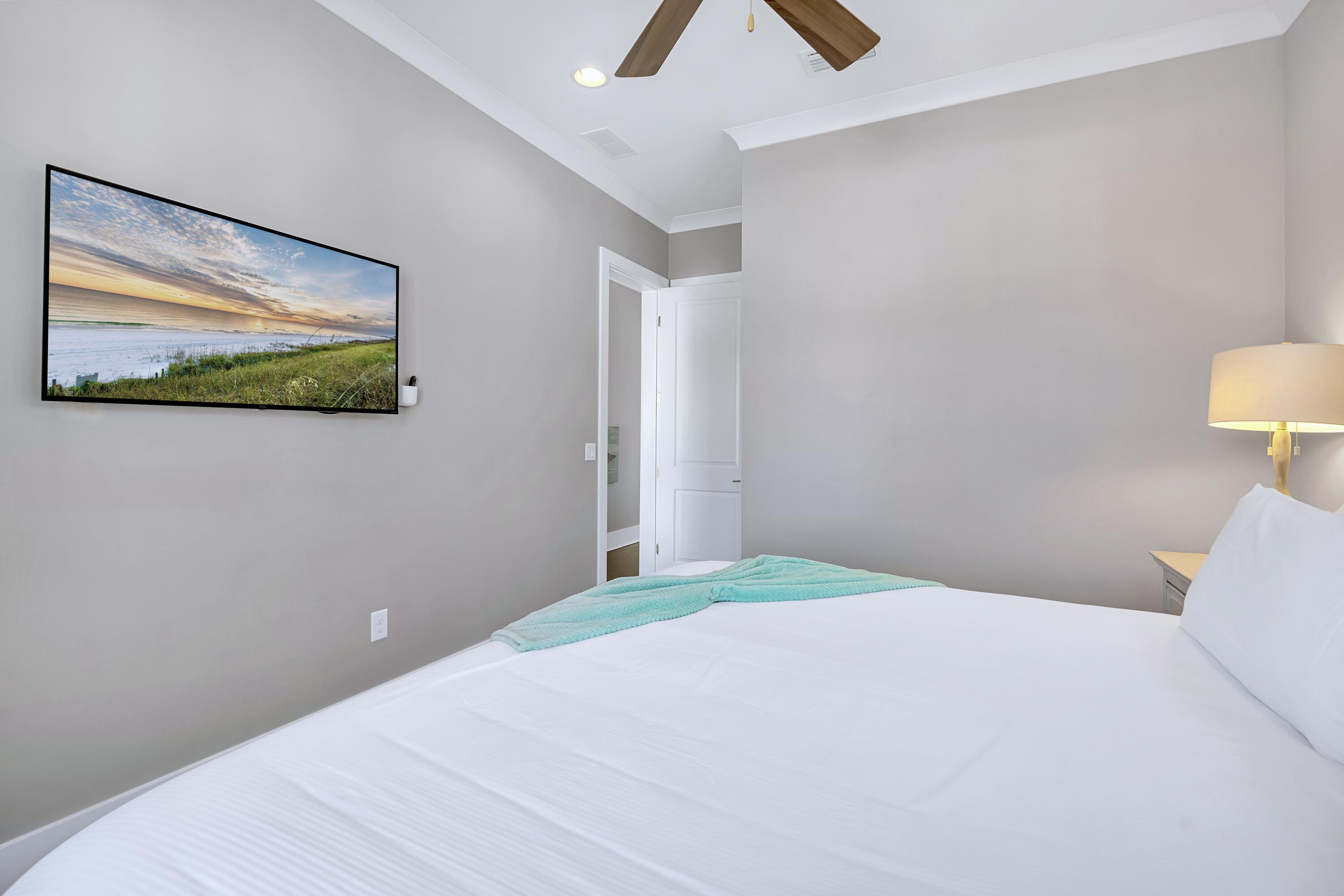95 Wadleigh Way Miramar Beach, FL 32550 - Photo 41 of 53 a bedroom with a bed and a painting on the wall