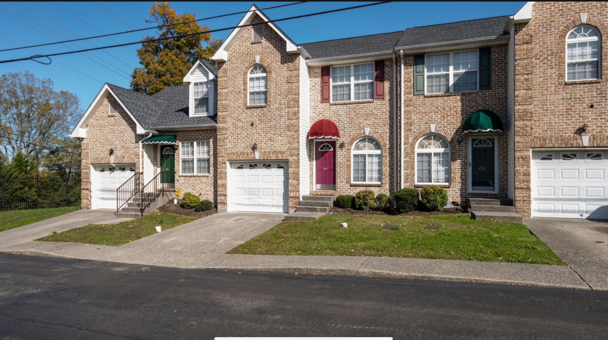 3001 Hamilton Church Road, Unit 403 Antioch, TN 37013 - Photo 2 of 21 a front view of a house with a yard
