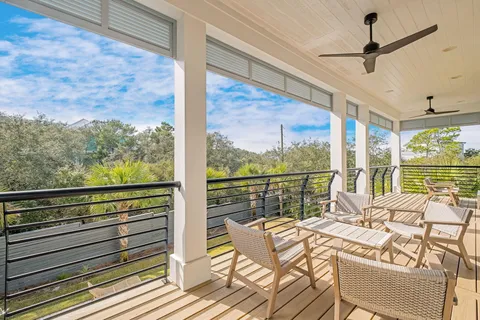 a view of a balcony with table and chairs