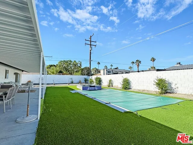 an aerial view of a house with swimming pool