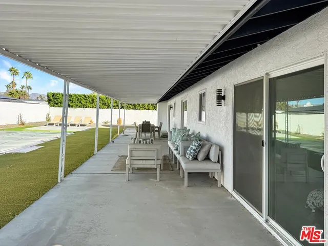 a outdoor space with patio the couches and a dining table with chairs