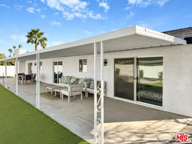 a view of an empty room with windows