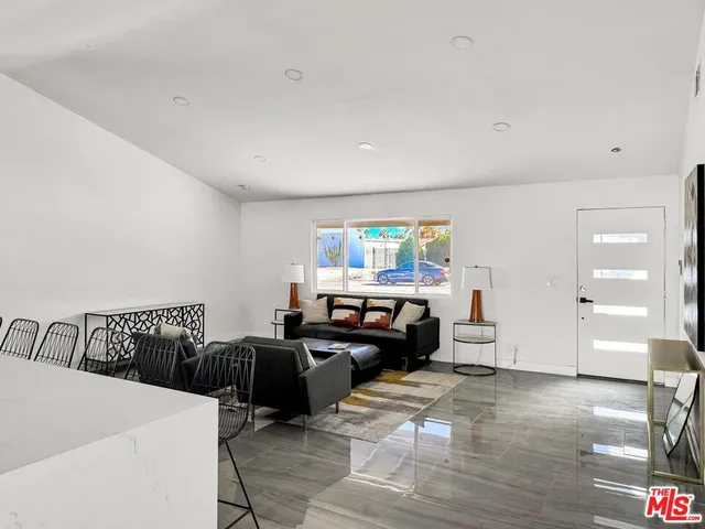 a kitchen with sink cabinets and wooden floor