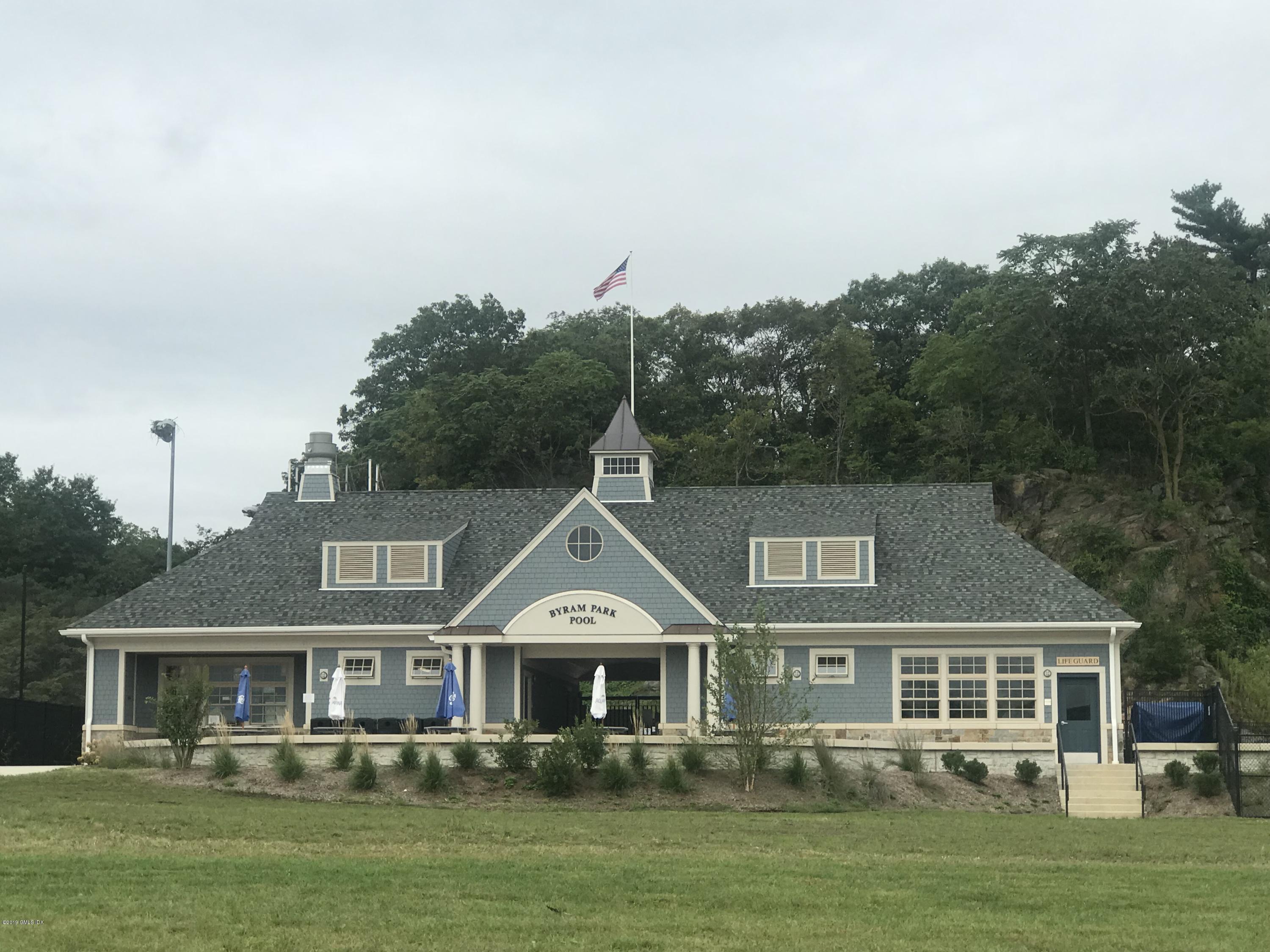 68 Byram Road, Unit 2 Greenwich, CT 06830 - Photo 13 of 20 a front view of a house with a yard